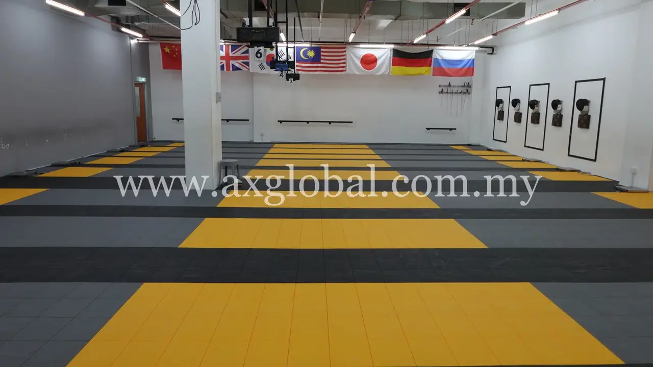 Yellow and dark interlocking sports floor for a fencing facility in Damansara